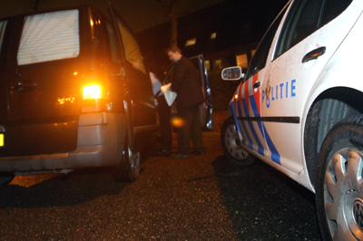Foto van lijkwagen en politieauto | Archief EHF