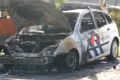 Foto van uitgebrande politieauto | Archief EHF