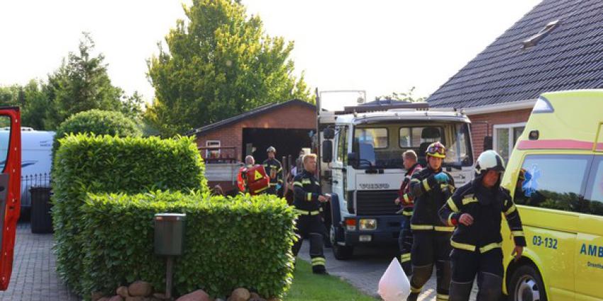 Man bekneld onder tractor in Buinen