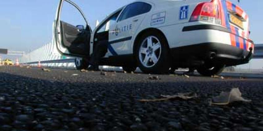 Foto van politieauto op vluchtstrook snelweg | Archief EHF