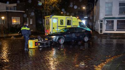 Botsing tussen auto en pizzabezorger