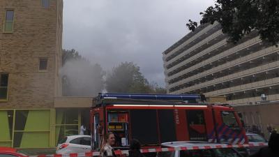 Rook uit flatwoning in Groningen
