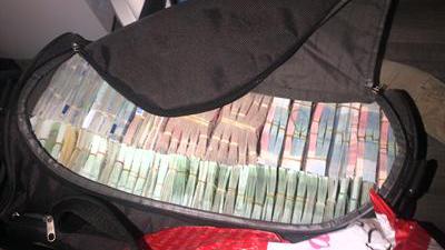 Foto van koffer vol met geld | Landelijk Parket