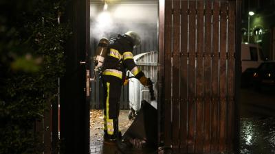 Afvalcontainer in containerhok in brand Bracbant Boxtel