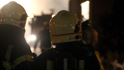 Foto van brandweermannen in de avond | Archief EHF