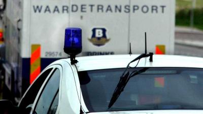 Foto van geldtransport en politieauto | Archief EHF
