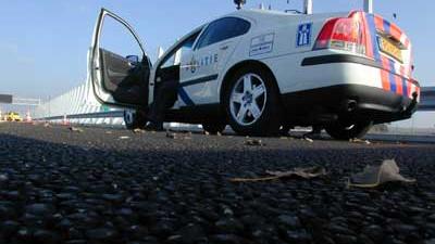 Foto van politieauto op vluchtstrook snelweg | Archief EHF