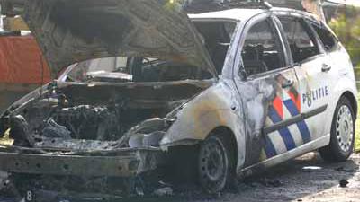 Foto van uitgebrande politieauto | Archief EHF