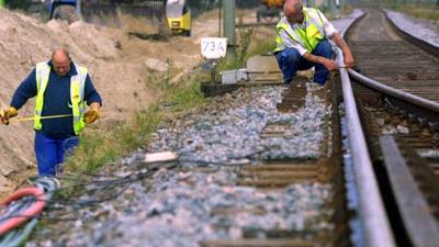 Foto van spoor arbeider rails trein | Archief EHF